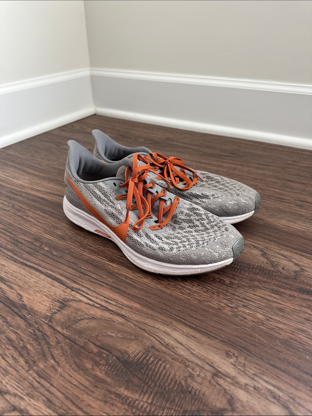 Nike Gray Running Shoes with Orange Swoosh and Laces